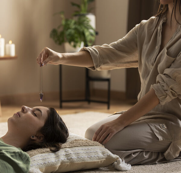 person-conducting-reiki-therapy